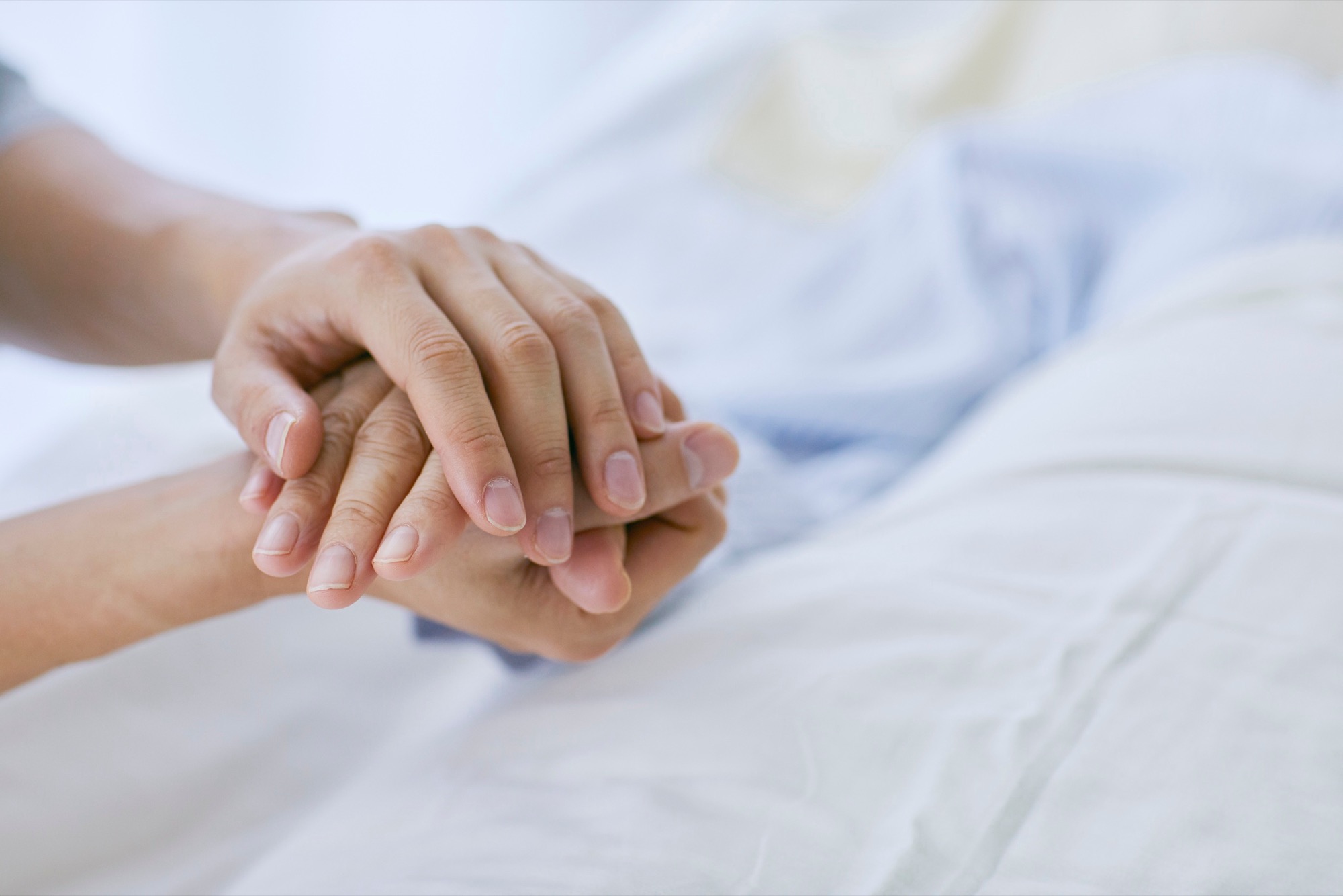 A caregiver supporting an older person